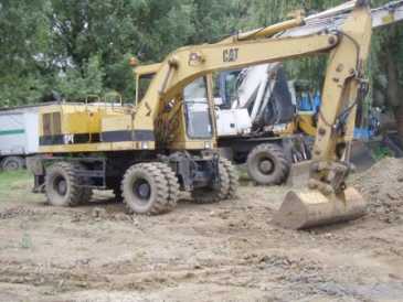 相片: 出售 卡车和公共事业 CATERPILLAR - 212